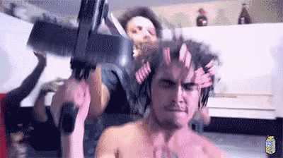 a man with a gun on his head and a woman holding a gun .