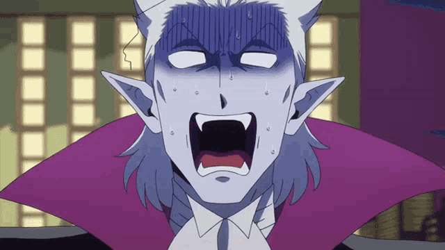 a close up of a vampire with a surprised expression on his face