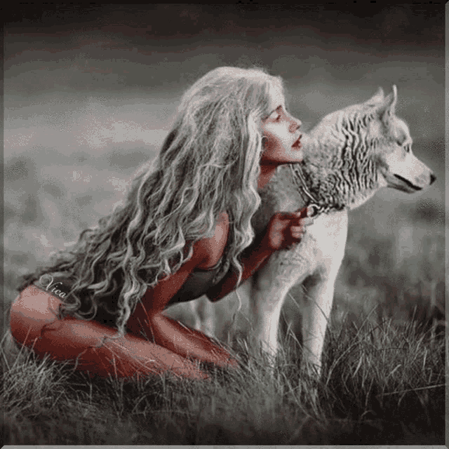 a woman is kneeling down next to a white dog with the name erica on the bottom