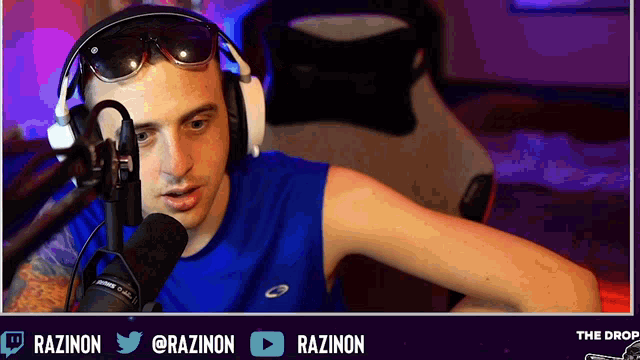 a man wearing sunglasses and headphones stands in front of a microphone with the hashtags razinon and @razinon below him