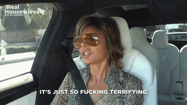 a woman wearing sunglasses says it 's just so fucking terrifying in a car