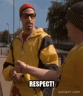 a man in a yellow jacket is shaking hands with another man and the words respect are on the screen .