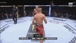 two men are fighting in a boxing ring with timex written on the bottom