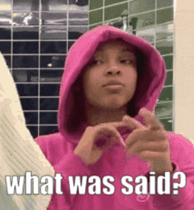 a girl in a pink hoodie is making a heart with her hands and says what was said ?