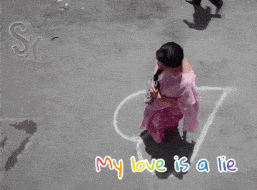 two women drawing a heart on the ground with the words my love is a lie