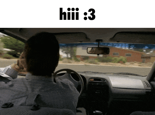 a man is driving a car with the number 3 on the dashboard