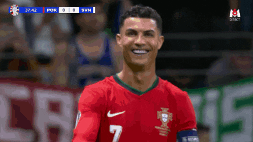 a soccer player with the number 7 on his jersey smiles
