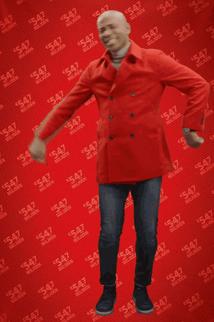 a man in a red coat is dancing in front of a red background with the word miljoen on it
