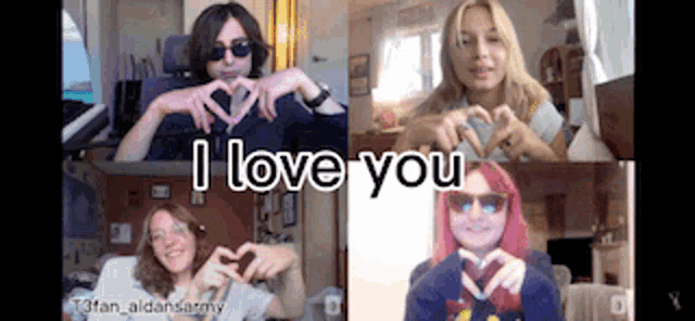 a group of people are making a heart shape with their hands and the words i love you