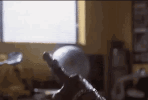 a globe is sitting in front of a window in a room