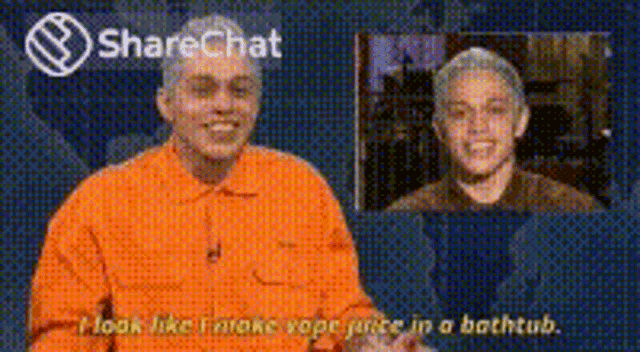 a man in an orange shirt is talking to another man in a bathtub on a sharechat video .