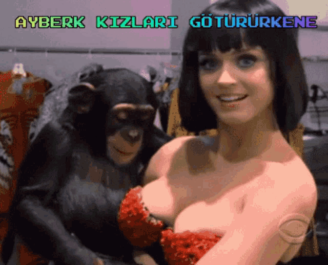 a woman in a red dress is holding a chimpanzee with ayberk kizlari gotururkene written above her