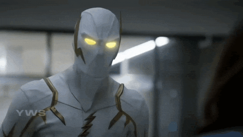 a close up of a person wearing a white and gold superhero suit with yellow eyes