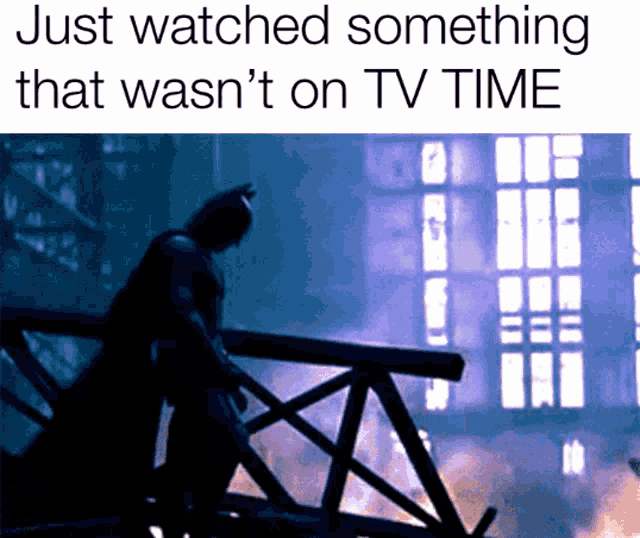 a silhouette of batman standing on a bridge with the words just watched something that wasn 't on tv time