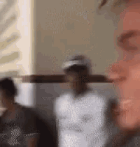 a blurry picture of a man 's face with a cross on it .