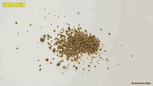 a pile of brown rocks with the word heroin written above it