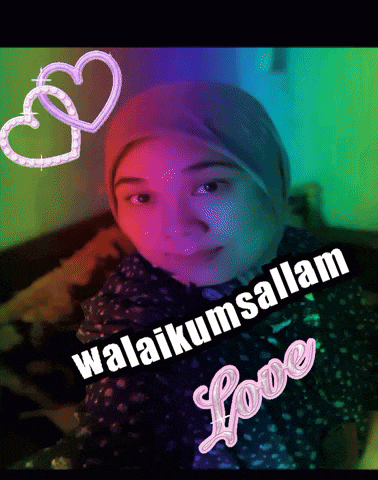 a woman wearing a head scarf with hearts and the words ' selamat love ' written on it