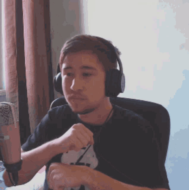 a man wearing headphones and a shirt that says 7 on it