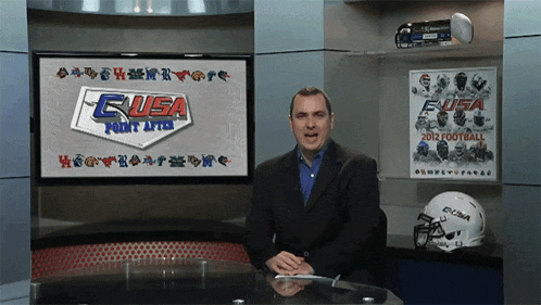 a man stands in front of a sign that says eusa point after