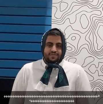 a man is wearing a scarf around his neck and head .