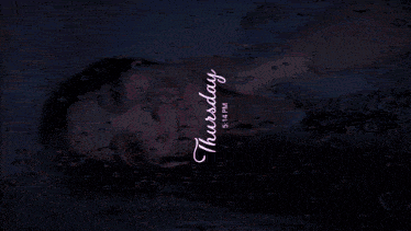 a woman is laying in a bathtub with water drops on her face and the date of thursday 9:14 pm