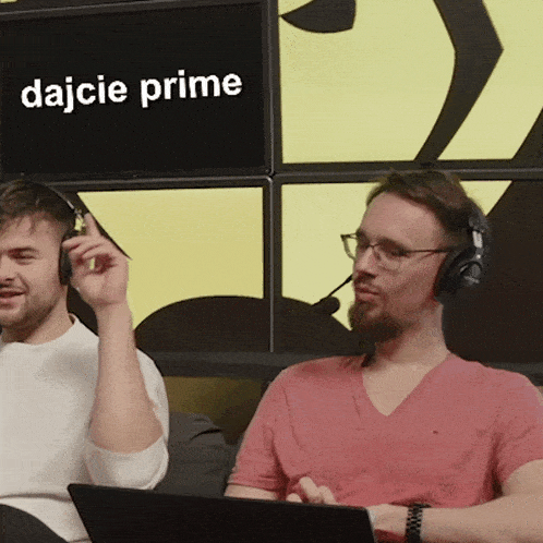 two men wearing headphones are sitting in front of a screen that says dajcie prime