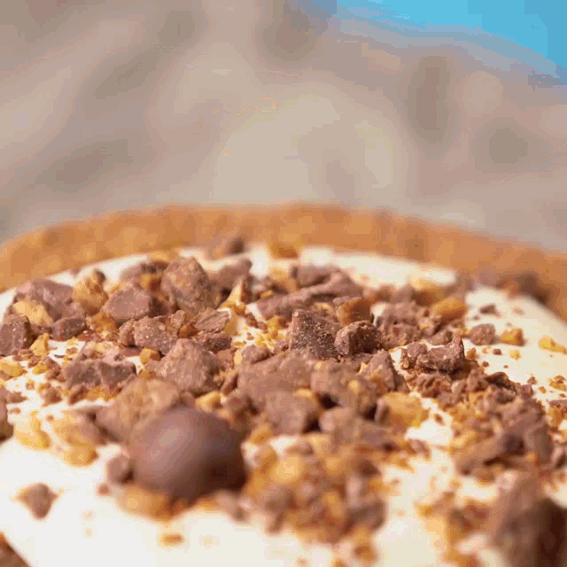a close up of a dessert with chocolate shavings on it