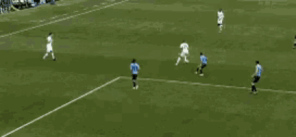 a group of soccer players are playing on a field with a sign that says ' nbc ' on it