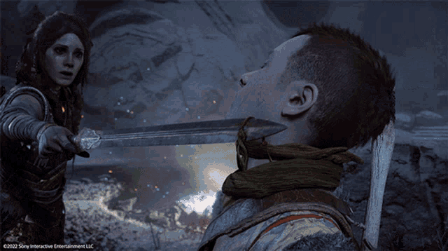 a woman is holding a sword in front of a man 's face and the words sony interactive entertainment llc can be seen