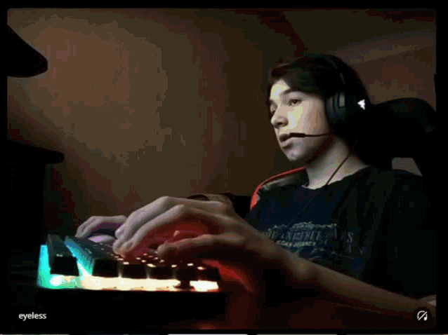 a person wearing headphones and a shirt that says road hockey on it is typing