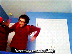a man is screaming uncontrollably in a room