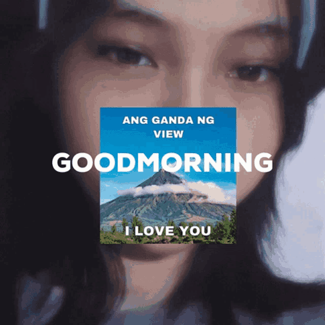a woman 's face is behind a poster that says good morning