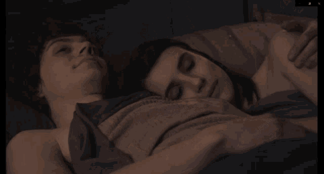 a man and a woman are laying on a bed and the man says did i just say that out loud yeah