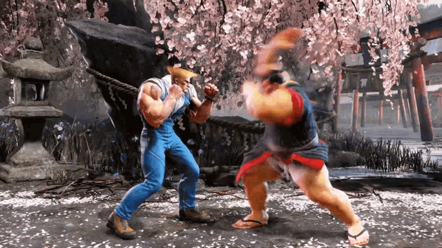 two men are fighting in a video game with cherry blossom trees in the background