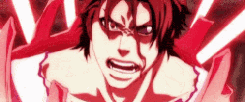 a close up of a man 's face with a very angry expression .