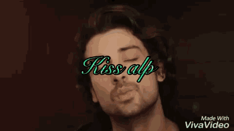 a man with a beard is blowing a kiss with the words kiss all written above him .