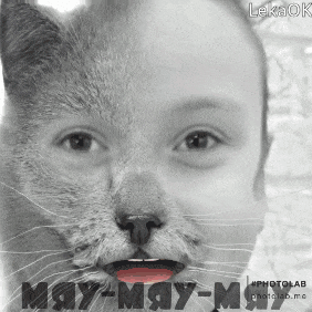 a black and white photo of a child 's face with a cat face