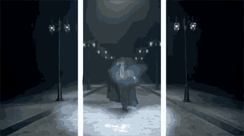 a man in a trench coat is holding an umbrella in the dark