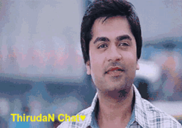 a close up of a man 's face with the name thiruda n chaty written on the bottom