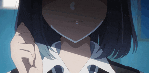 a close up of a girl 's face with a shadow on it