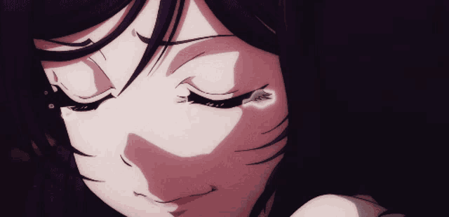 a close up of a girl 's face with a tear coming out of her eye