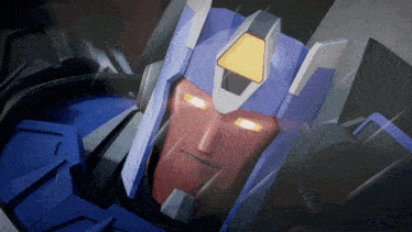 a close up of a robot 's face with glowing yellow eyes