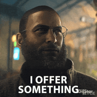 a man with a beard and glasses says " i offer something "