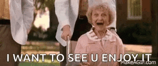 an elderly woman is holding a cane and laughing while a man holds her hand .