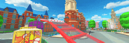 a roller coaster is going through a city with a tower in the background