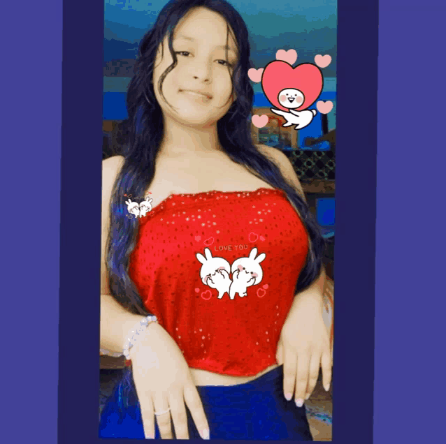 a woman wearing a red top that says love you
