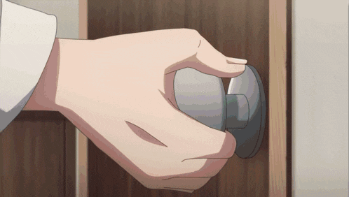 a close up of a person 's hand opening a door knob