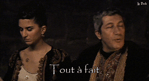 a woman and a man are standing next to each other and the words j'ai pas percute are visible