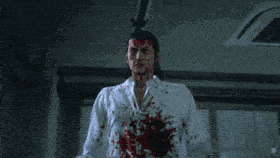 a man in a white shirt with blood on his shirt