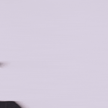 a close up of a woman 's face with a blurry background .